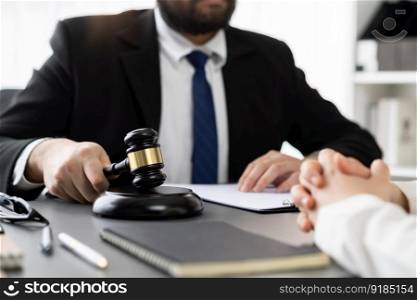 Lawyer colleagues or legal team working or drafting legal document at law firm office desk. Gavel hammer for righteous and equality judgment by lawmaker and attorney. Equilibrium. Lawyer colleagues or legal team working at law firm office desk. Equilibrium