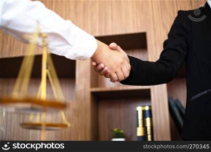 lawyer consultant hand shaking with client successful project.