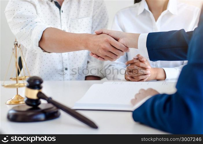 lawyer consultant negotiating a contract hand shaking deal