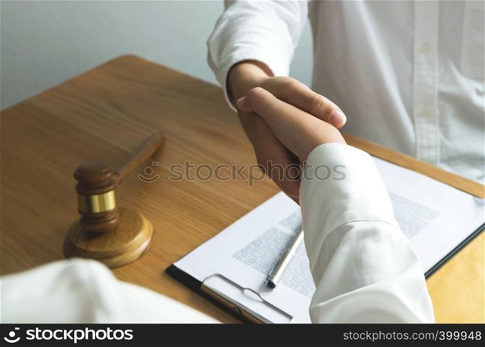 Lawyer handshake. Lawyer people shaking hands with client, finishing up a meeting,Success agreement negotiation.