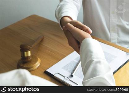 Lawyer handshake. Lawyer people shaking hands with client, finishing up a meeting,Success agreement negotiation.