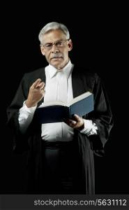 Lawyer holding a law book