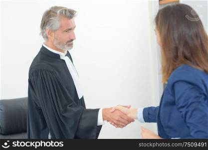 lawyer meeting client in courthouse office