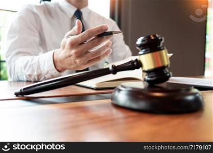 lawyer or judge business man working with paperwork agreement contract and gavel in Courtroom, Justice and Law firm Notary public concept.