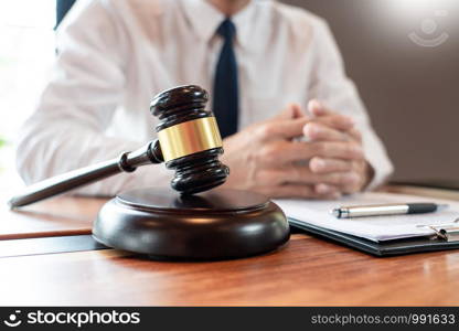 lawyer or judge business man working with paperwork agreement contract and gavel in Courtroom, Justice and Law firm Notary public concept.