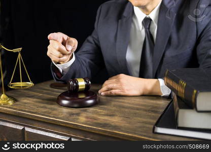 Lawyer or judge consult meeting with client at a law firm about legal legislation in courtroom with Judge gavel and Gold brass balance scale