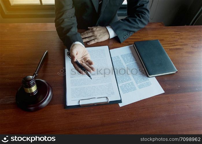 Lawyer present client with contract papers on the table in office. consultant lawyer, attorney, court judge, concept.