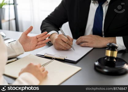 Lawyer signing contract, professional lawyer in law firm office drafting legal document or contract agreement ensuring lawful protection for client’s disputes as fairness advocate concept. Equilibrium. Lawyers signing contract in law firm office concept. Equilibrium