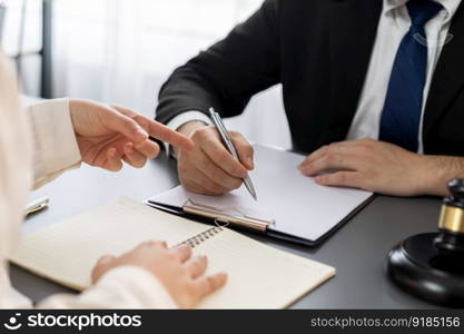 Lawyer signing contract, professional lawyer in law firm office drafting legal document or contract agreement ensuring lawful protection for client’s disputes as fairness advocate concept. Equilibrium. Lawyers signing contract in law firm office concept. Equilibrium