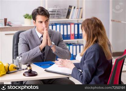 Lawyer talking to client in office