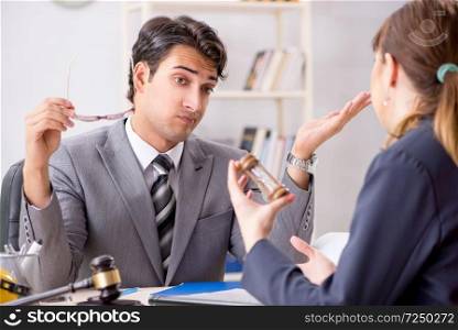 Lawyer talking to client in office