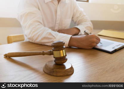 Lawyer working on the table in office. consultant lawyer, attorney, court judge, concept.