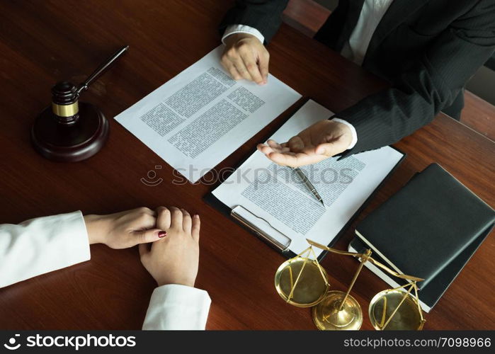 Lawyer working with contract client on the table in office. consultant lawyer, attorney, court judge, concept.