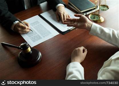 Lawyer working with contract client on the table in office. consultant lawyer, attorney, court judge, concept.