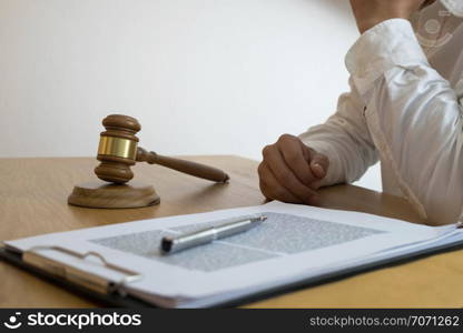 Lawyer working with contract papers on the table in office. consultant lawyer, attorney, court judge, concept.