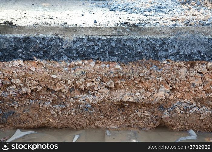Layer soil beneath asphalt cement concrete