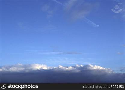 Layers of Clouds In A Clear Blue Sky