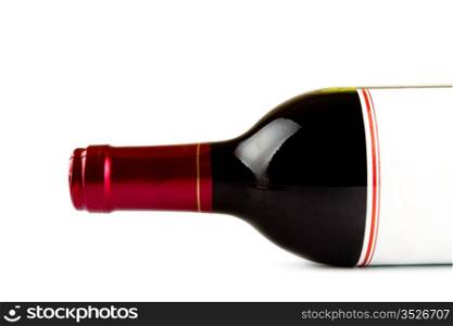 laying bottle of red wine closeup, white background