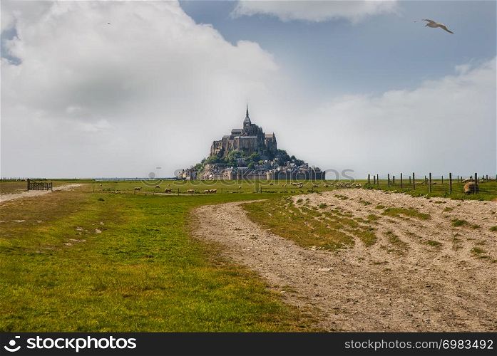 Le Mont Saint Michelewith blue sky and clouds, Normandy, northern France. Le Mont Saint Michelewith blue sky and clouds.
