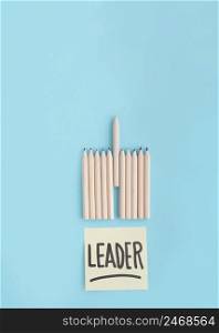 leader text adhesive note with row colored pencil blue backdrop