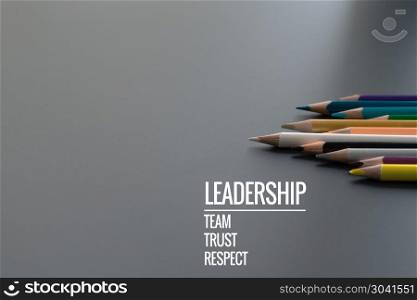 Leadership business concept. Gold color pencil lead other color . Leadership business concept. Gold color pencil lead other color with word Leadership, team, trust and respect on black background
