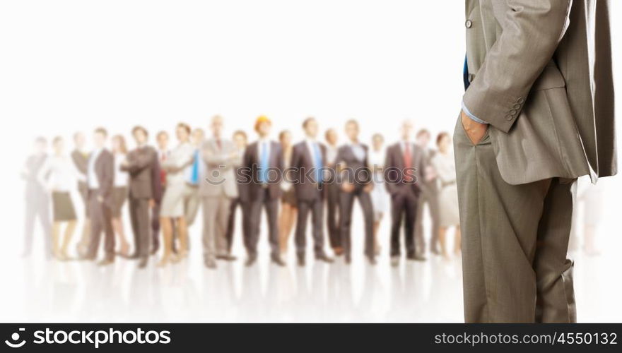 Leadership concept. Back view of confident businessman with business team at background