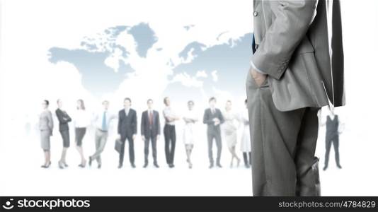 Leadership concept. Back view of confident businessman with business team at background