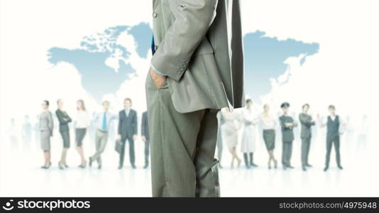 Leadership concept. Back view of confident businessman with business team at background