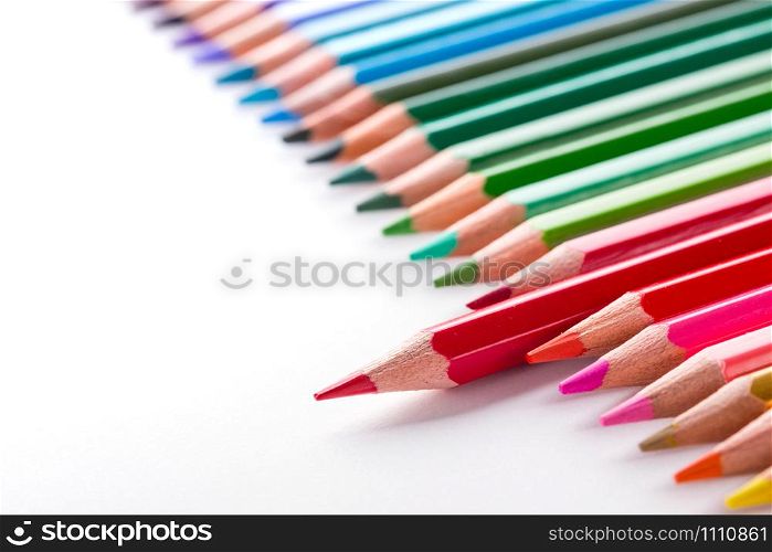 leadership concept with one pencil standing out of crowd of other pencils