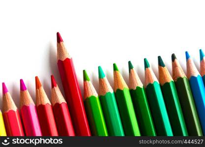 leadership concept with one pencil standing out of crowd of other pencils