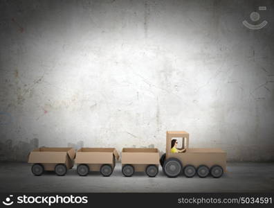 Leadership in business. Young woman riding carton train. Women in business