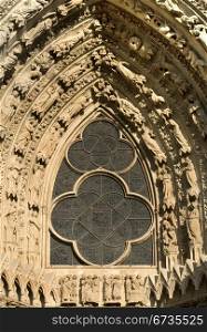Leadlight Window and ornate stone carvings, Reims Cathedral, France