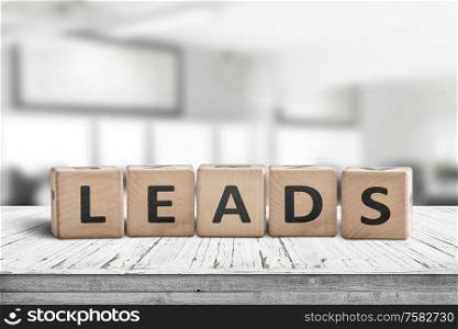 Leads sign in a bright office environment on a wooden desk with blocks