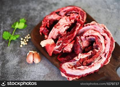 Lean meat beef butcher grilled barbecue / Fresh raw meat beef for grill with spices garlic on wooden cutting board and black backgroun , top view