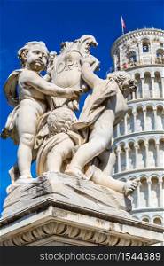 Leaning tower in Pisa with statue of angels in a summer day in Italy
