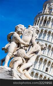 Leaning  tower in Pisa with statue of angels   in a summer day in Italy