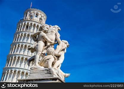 Leaning  tower in Pisa with statue of angels   in a summer day in Italy