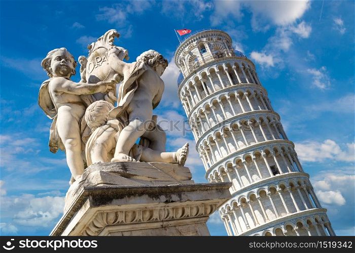 Leaning tower in Pisa with statue of angels, Italy in a beautiful summer day
