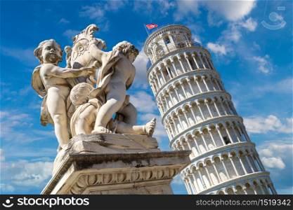 Leaning tower in Pisa with statue of angels, Italy in a beautiful summer day