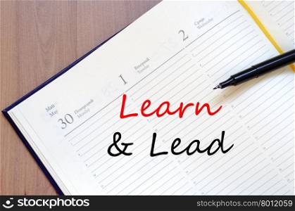 Learn &amp; Lead text concept write on notebook