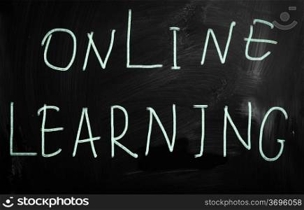 ""Learn online" handwritten with white chalk on a blackboard"