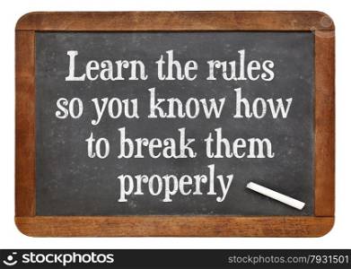 Learn the rules, so you know hot to break them properly. INspirational words on a vintage slate blackboard