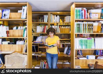 learning lady standing bookcases