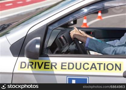 Learning to drive a car. Driving school. Driver education.