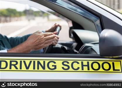 Learning to drive a car. Driving school. Driver education.