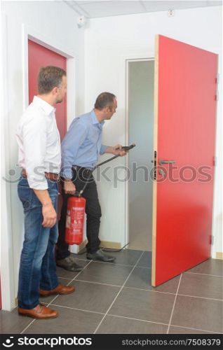 learning to use a fire extinguisher