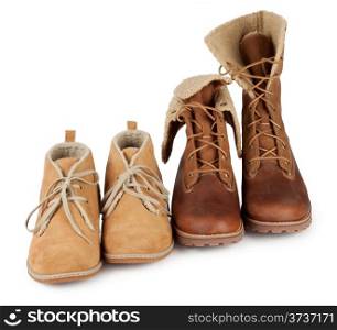 Leather boots standing in a row on a white background