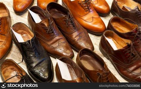 Leather shoes of different colors and types at shoe care service.. Shoe Care Service