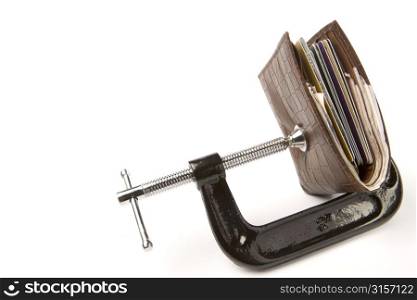 Leather Wallet Being Held In Clamp On White Background