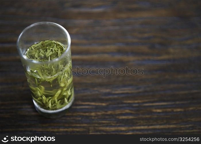 Leaves in a glass on the table